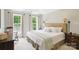 Bright bedroom featuring two windows, soft natural light, and neutral tones create a tranquil retreat at 3112 Planters Ridge Rd, Charlotte, NC 28270