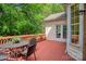 Inviting deck with outdoor seating overlooks serene, wooded backyard, perfect for relaxing and entertaining at 3112 Planters Ridge Rd, Charlotte, NC 28270