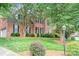 Beautiful brick home features lush landscaping, a side-entry garage, and a well-maintained lawn at 3112 Planters Ridge Rd, Charlotte, NC 28270