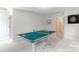 Bright game room with a ping pong table and dart board at 3112 Planters Ridge Rd, Charlotte, NC 28270