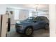 Spacious garage showcasing a blue SUV parked, offering ample space for vehicles and storage at 3112 Planters Ridge Rd, Charlotte, NC 28270