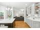 Bright kitchen with white countertops, gray cabinets, and an open view to the living room at 3112 Planters Ridge Rd, Charlotte, NC 28270