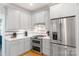 Updated kitchen with stainless steel appliances and white subway tile backsplash at 3112 Planters Ridge Rd, Charlotte, NC 28270