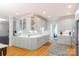 Spacious kitchen with gray cabinetry, white countertops, and hardwood floors at 3112 Planters Ridge Rd, Charlotte, NC 28270