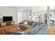 Comfortable living room with a large sectional sofa and view into the kitchen at 3112 Planters Ridge Rd, Charlotte, NC 28270