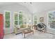 Bright living room featuring a vaulted ceiling, lots of natural light, and a home office space at 3112 Planters Ridge Rd, Charlotte, NC 28270