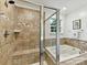 Elegant bathroom featuring a separate shower, soaking tub, and neutral tile accents at 3609 Benseval Ln, Matthews, NC 28105