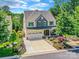 Aerial view of a two-story home with a two car garage, a front porch, and an attractive landscaped yard at 3609 Benseval Ln, Matthews, NC 28105
