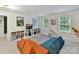 Bright play room with shelving, plenty of natural light, and cozy seating at 3609 Benseval Ln, Matthews, NC 28105