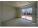 The room features a sliding glass door out to a private terrace area at 3618 S Tryon St # 19, Charlotte, NC 28217
