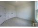 This is a bedroom with plush carpeting and an abundance of natural light at 3618 S Tryon St # 19, Charlotte, NC 28217