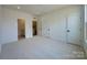 Bright bedroom with neutral carpet, multiple closets, and access to a bathroom at 3618 S Tryon St # 19, Charlotte, NC 28217