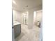 Bathroom featuring a large vanity, tiled floors, and a glass enclosed walk-in shower at 3816 Rosewood Dr, Mount Holly, NC 28120