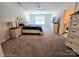 Spacious main bedroom with a large window, neutral walls, and elegant furniture at 3816 Rosewood Dr, Mount Holly, NC 28120