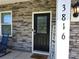 A front door with glass detail is set in a stone facade, and includes the house address at 3816 Rosewood Dr, Mount Holly, NC 28120