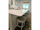 Kitchen island featuring a sink, quartz countertops, and seating perfect for entertaining at 3816 Rosewood Dr, Mount Holly, NC 28120