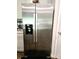 Modern, stainless steel refrigerator with a built-in water and ice dispenser at 3816 Rosewood Dr, Mount Holly, NC 28120