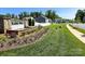 Well-manicured street view showcasing the community's landscaping, sidewalks, and attractive home exteriors at 3816 Rosewood Dr, Mount Holly, NC 28120