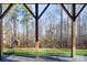 Backyard featuring a charming playhouse and swing set with views of the surrounding nature at 394 Stonecliff Ln, Clover, SC 29710