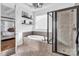Bathroom featuring a glass shower, soaking tub and a glimpse of the Primary bedroom at 394 Stonecliff Ln, Clover, SC 29710