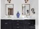 Bathroom featuring double vanities with framed mirrors, with designer blue and white porcelain vase at 394 Stonecliff Ln, Clover, SC 29710