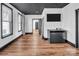 Cozy bedroom features durable wood flooring, a television, and neutral decor at 394 Stonecliff Ln, Clover, SC 29710