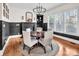 Cozy dining area with modern lighting and views of the backyard through large windows at 394 Stonecliff Ln, Clover, SC 29710