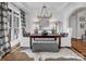 Elegant dining room featuring natural light, white walls, and hardwood floors at 394 Stonecliff Ln, Clover, SC 29710