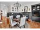 Elegant dining room featuring a round table, stylish chandelier, and decorative fireplace at 394 Stonecliff Ln, Clover, SC 29710