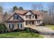 Charming two-story home with a combination of stone, wood, and stucco exterior at 394 Stonecliff Ln, Clover, SC 29710