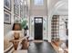 Inviting foyer with black slate floors and natural light filtering through the front door at 394 Stonecliff Ln, Clover, SC 29710