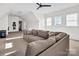 Large, bright bonus room features a comfortable sectional, ceiling fan and is ready to be enjoyed at 394 Stonecliff Ln, Clover, SC 29710