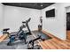 Home gym boasts modern exercise equipment and a wall-mounted TV for entertainment, providing a convenient fitness space at 394 Stonecliff Ln, Clover, SC 29710
