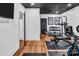Spacious home gym featuring weights, modern exercise equipment, and sleek design, offering a convenient and stylish workout area at 394 Stonecliff Ln, Clover, SC 29710