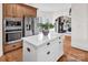 Modern kitchen island with quartz countertops and stainless steel appliances, offering a sleek design at 394 Stonecliff Ln, Clover, SC 29710