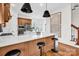 Spacious kitchen with an island, pendant lighting, and stainless steel appliances for a modern look at 394 Stonecliff Ln, Clover, SC 29710