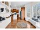 Bright living area with hardwood floors, open shelving, and a glimpse into a modern kitchen at 394 Stonecliff Ln, Clover, SC 29710