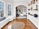 Cozy sitting area with a window seat, leading to a living room featuring a fireplace and shelving at 394 Stonecliff Ln, Clover, SC 29710