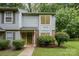 Charming two story home with blue siding, brick accents, and beautiful lawn at 3941 Briarhill Dr, Charlotte, NC 28215