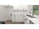 Kitchen featuring quartz countertops, subway tile backsplash, and modern fixtures, creating a stylish workspace at 3941 Briarhill Dr, Charlotte, NC 28215