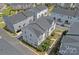 An aerial view showcases the charming neighborhood with modern townhomes, manicured lawns and inviting curb appeal at 4008 Yucca Aly, Charlotte, NC 28217