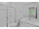 A well-lit bathroom featuring a walk-in shower and single sink vanity at 4008 Yucca Aly, Charlotte, NC 28217