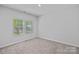 A bright bedroom with carpet, a double window, and neutral walls at 4008 Yucca Aly, Charlotte, NC 28217