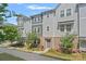 Charming townhouse with a gray exterior, brick accents, and well-maintained landscaping at 4008 Yucca Aly, Charlotte, NC 28217