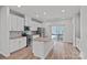 Bright kitchen features white cabinets, stainless steel appliances, and granite counters at 4008 Yucca Aly, Charlotte, NC 28217
