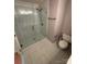 Modern bathroom features a glass-enclosed shower with contemporary fixtures at 4151 Town Center Rd, Harrisburg, NC 28075