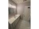 Bathroom features vanity with modern faucet and updated mirror at 4151 Town Center Rd, Harrisburg, NC 28075