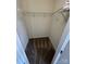 Walk-in closet features built-in shelving and carpet at 4151 Town Center Rd, Harrisburg, NC 28075