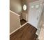 Inviting entryway features hardwood floors, storage cabinet and access to the front door at 4151 Town Center Rd, Harrisburg, NC 28075