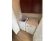 Well-equipped laundry area features full-size washer and dryer, along with overhead cabinets for storage at 4151 Town Center Rd, Harrisburg, NC 28075
